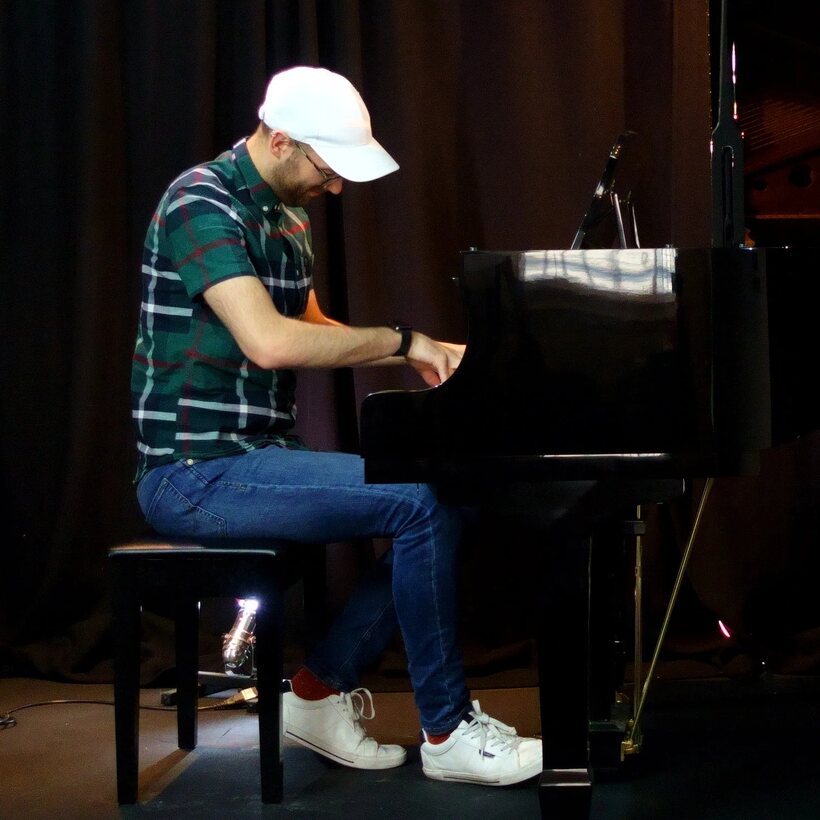 Matthew Cawood performing at the grand piano